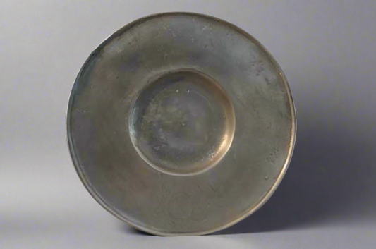 A mid 18th Century Pewter broad rim dish