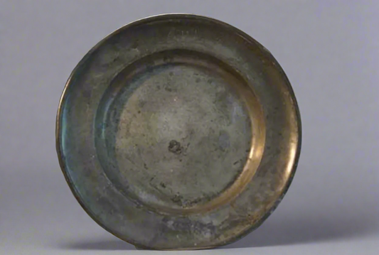 A mid 18th century large antique pewter plate